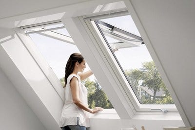 white top hung roof windows installed in loft
